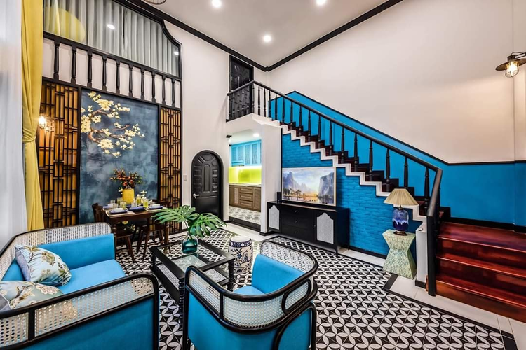 Thiết kế phòng khách cho chung cư theo phong cách Indochine với tông màu xanh mới mẻ (Nguồn: Internet)