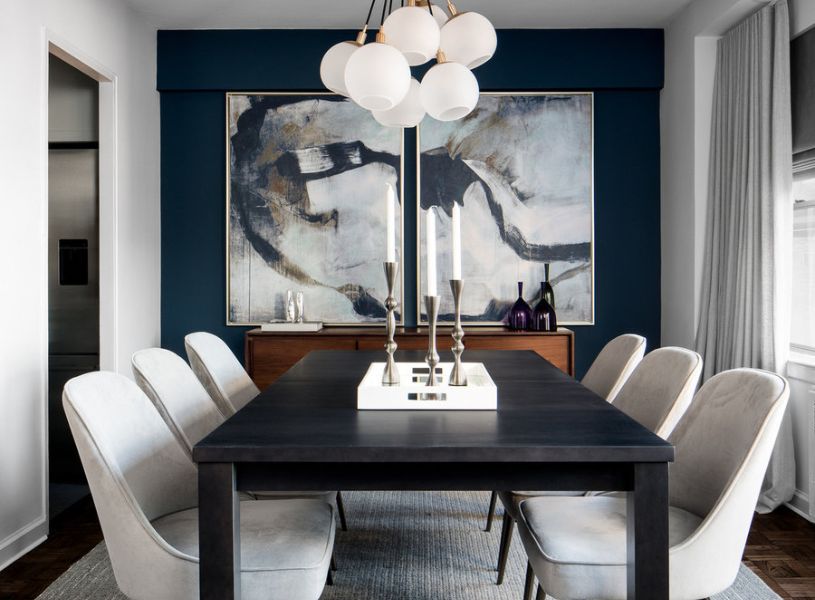 A mid-century living room hits the difference with the dark blue and light gray color scheme.