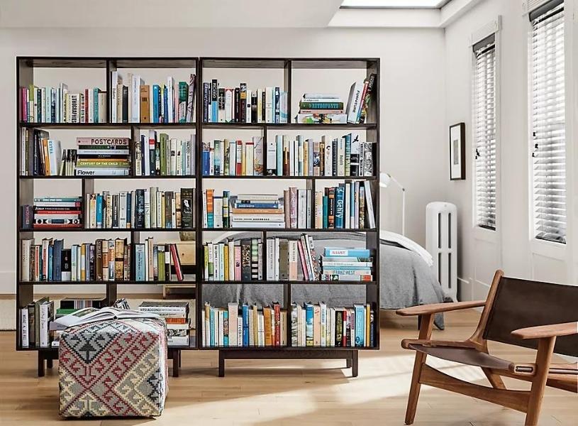 Divide studio apartment decor by bookshelf