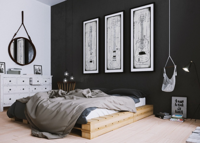 Thiết kế nội thất phòng ngủ đơn giản kết hợp cùng bức tường màu đen đặc trưng, chiếc giường pallet và các bức tranh nghệ thuật
